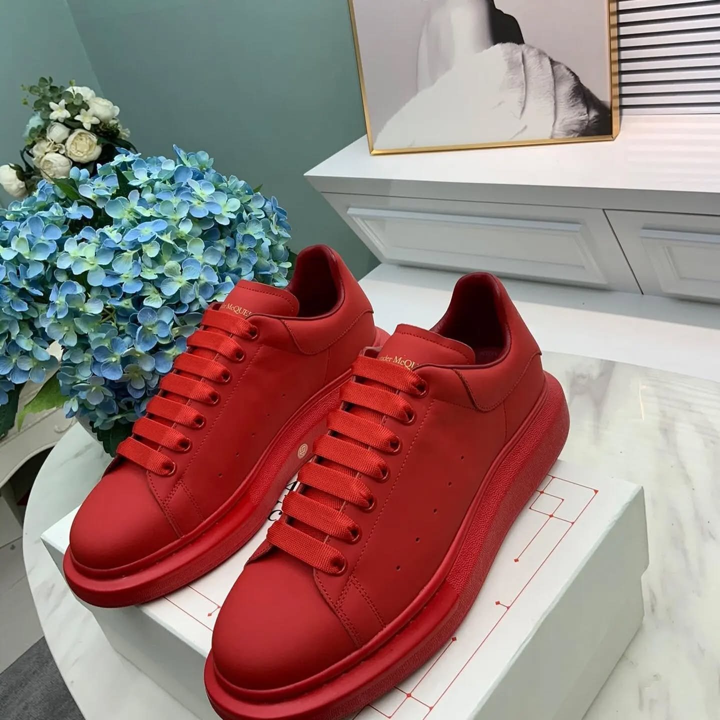 Pallet of authentic Alexander McQueen Oversized Sneakers in original retail boxes for wholesale luxury resale