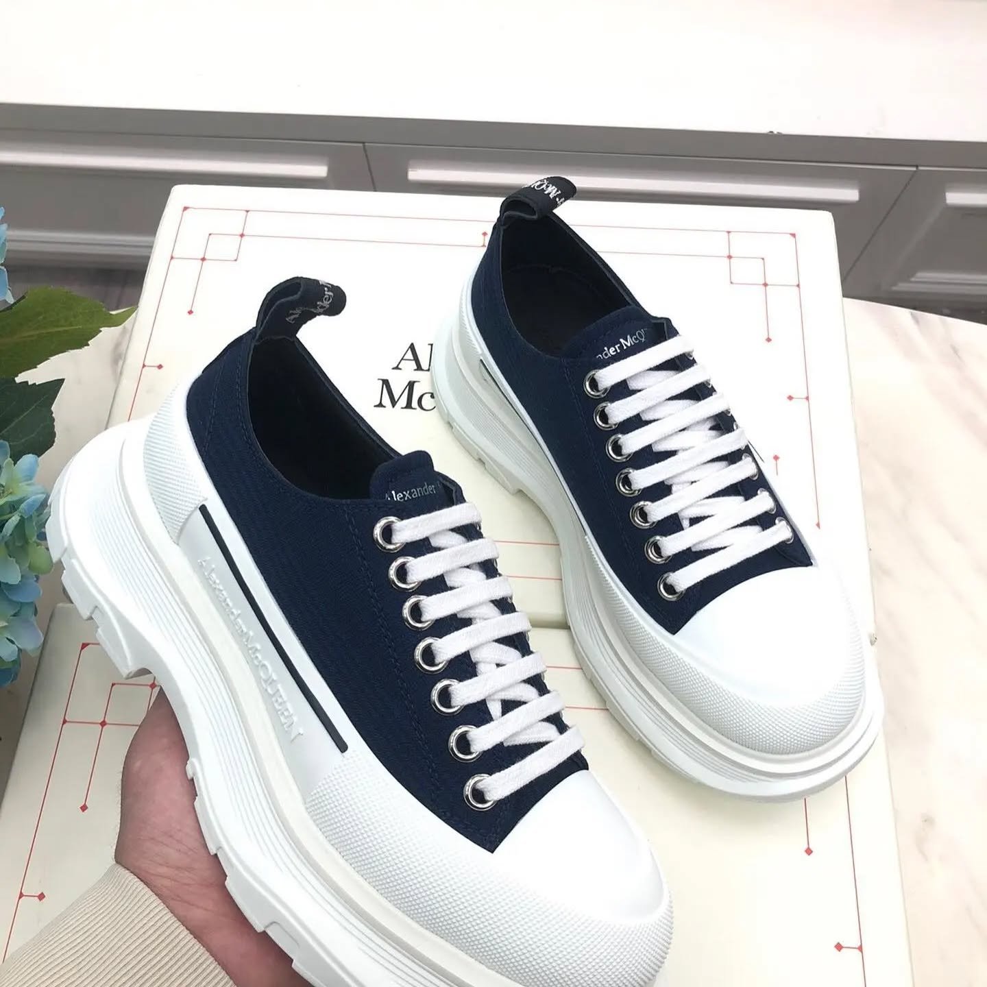 Pallet of authentic Alexander McQueen Oversized Sneakers in original retail boxes for wholesale luxury resale